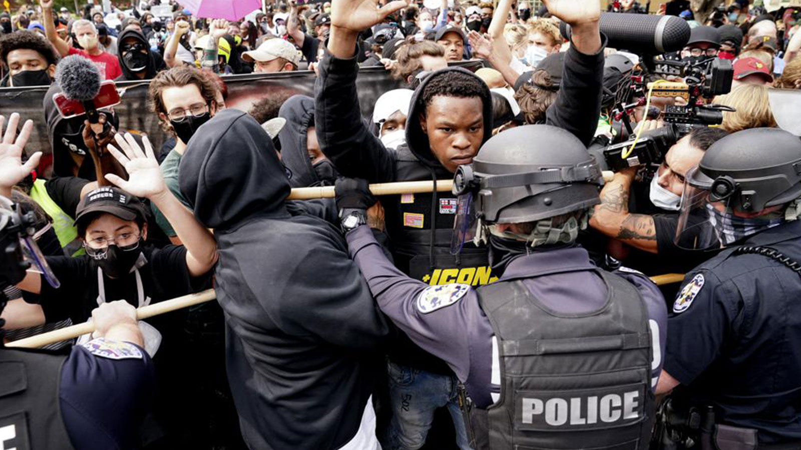 Police and protesters converge on Sept. 23, 2020 during a demonstration in Louisville, Kentucky. 