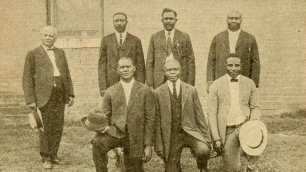 A dozen Black men were convicted of murder by all-white juries in connection with the 1919 massacre in Elaine, Ark. Above, defendants S.A. Jones, Ed Hicks, Frank Hicks, Frank Moore, J.C. Knox, Ed Coleman and Paul Hall with their attorney at the state penitentiary in Little Rock in 1925 after the Supreme Court overturned their convictions.