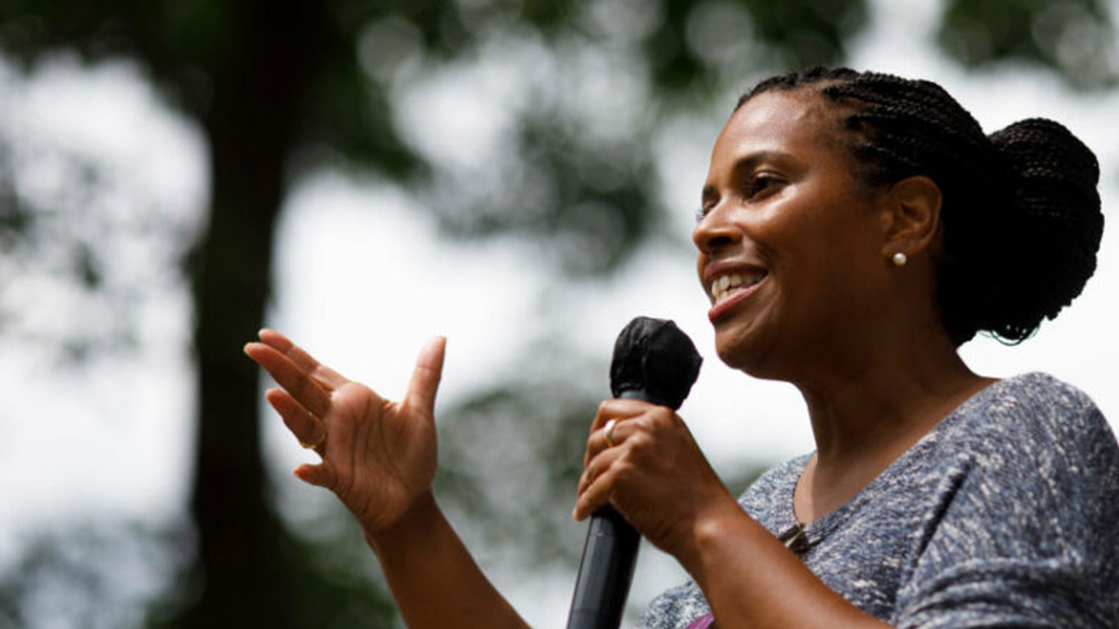 Tanisha Sullivan, president of Boston's NAACP chapter, speaks at a closing awards ceremony after July's Negro Election Day parade in Salem, MA.