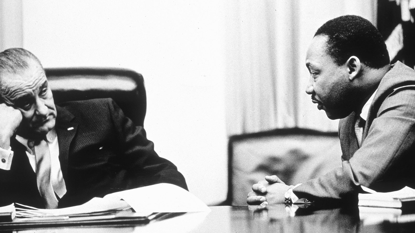 In this 1965 photo, President Lyndon B. Johnson discusses the Voting Rights Act with Martin Luther King Jr. 