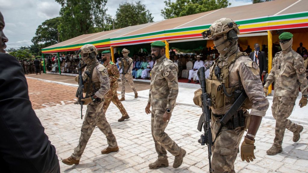 Lt. Col. Assimi Goïta, leader of Mali's ruling junta, attends an independence day military parade in Bamako, Mali, on Sept. 22.