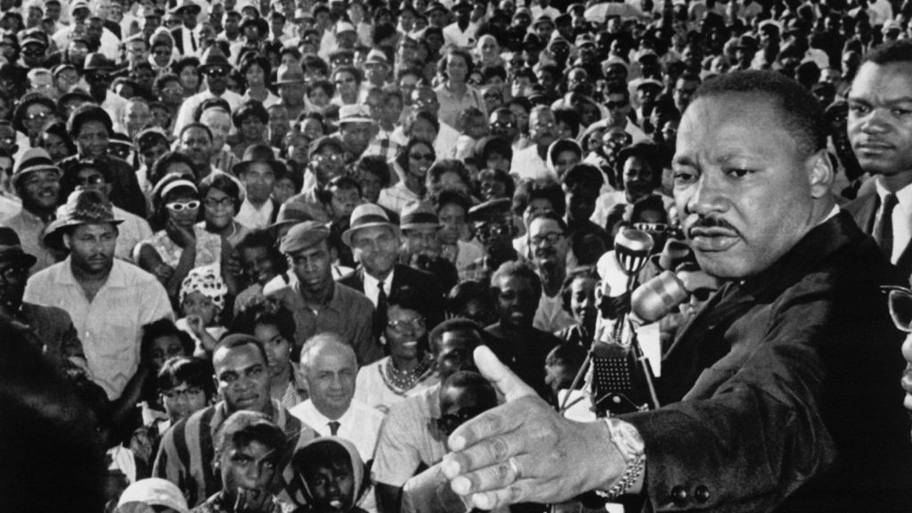 The Rev. Martin Luther King Jr. addresses a cheering crowd in Cleveland, Ohio, on July 27, 1965.