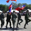 Haiti - Soldiers marching with Hattian flag.