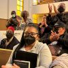 People applaud chair Kamilah Moore during a reparations task force meeting at Third Baptist Church in San Francisco, Wednesday, April 13, 2022. California's first-in-the-nation reparations task force met for the first time since its inaugural meeting nearly a year ago. The live meeting also comes mere weeks after the group voted to limit restitution to descendants of enslaved or free Black people in the U.S. before the 20th century.