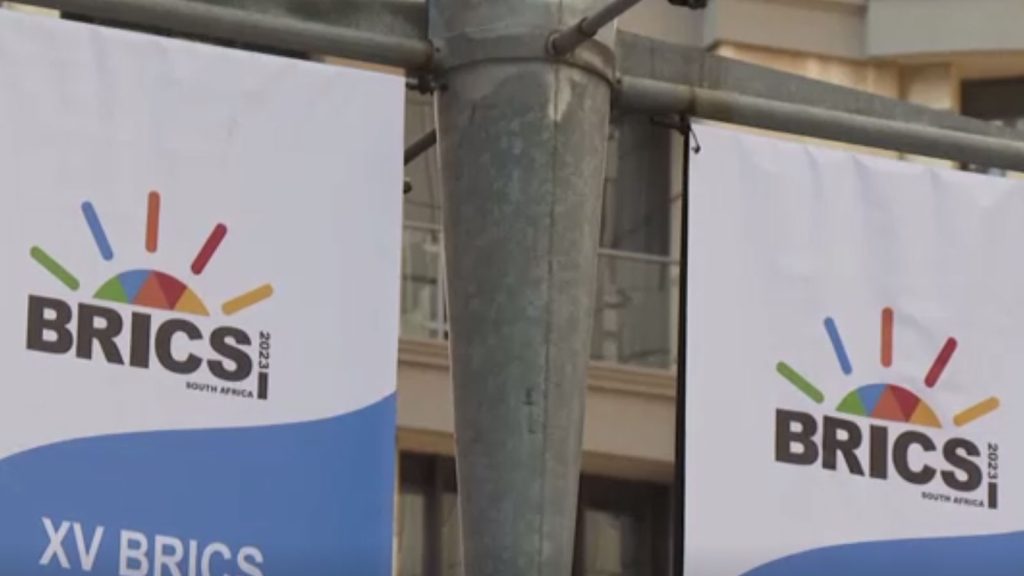 Banners for the upcoming BRICS, Brazil, Russia, India, China, and South Africa summit hang from a pole outside the Sandton Convention Centre in Johannesburg, South Africa