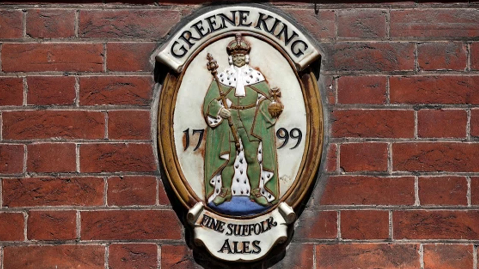 A Greene King plaque outside its brewery and headquarters in Bury St Edmunds, Suffolk, Britain.