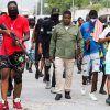 Former police officer Jimmy "Barbecue" Cherizier, leader of the 'G9' coalition, leads a march surrounded by his security against Haiti's Prime Minister Ariel Henry, in Port-au-Prince, Haiti.