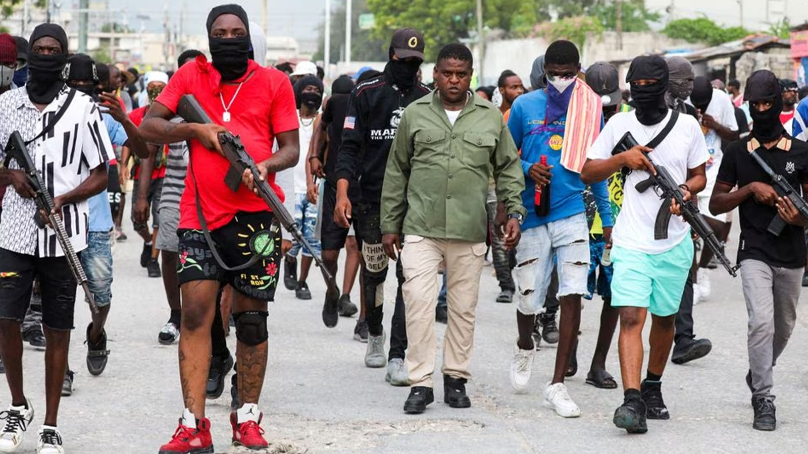Former police officer Jimmy "Barbecue" Cherizier, leader of the 'G9' coalition, leads a march surrounded by his security against Haiti's Prime Minister Ariel Henry, in Port-au-Prince, Haiti. 