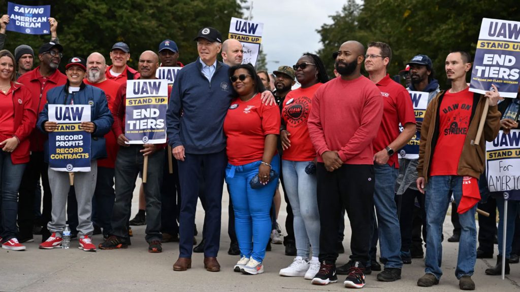 President Biden joins a picket line with members of the United Auto Workers at a General Motors Service Parts Operations plant in Belleville, Mich. on Tuesday.