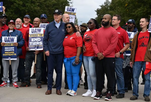 President Biden joins a picket line with members of the United Auto Workers at a General Motors Service Parts Operations plant in Belleville, Mich. on Tuesday.
