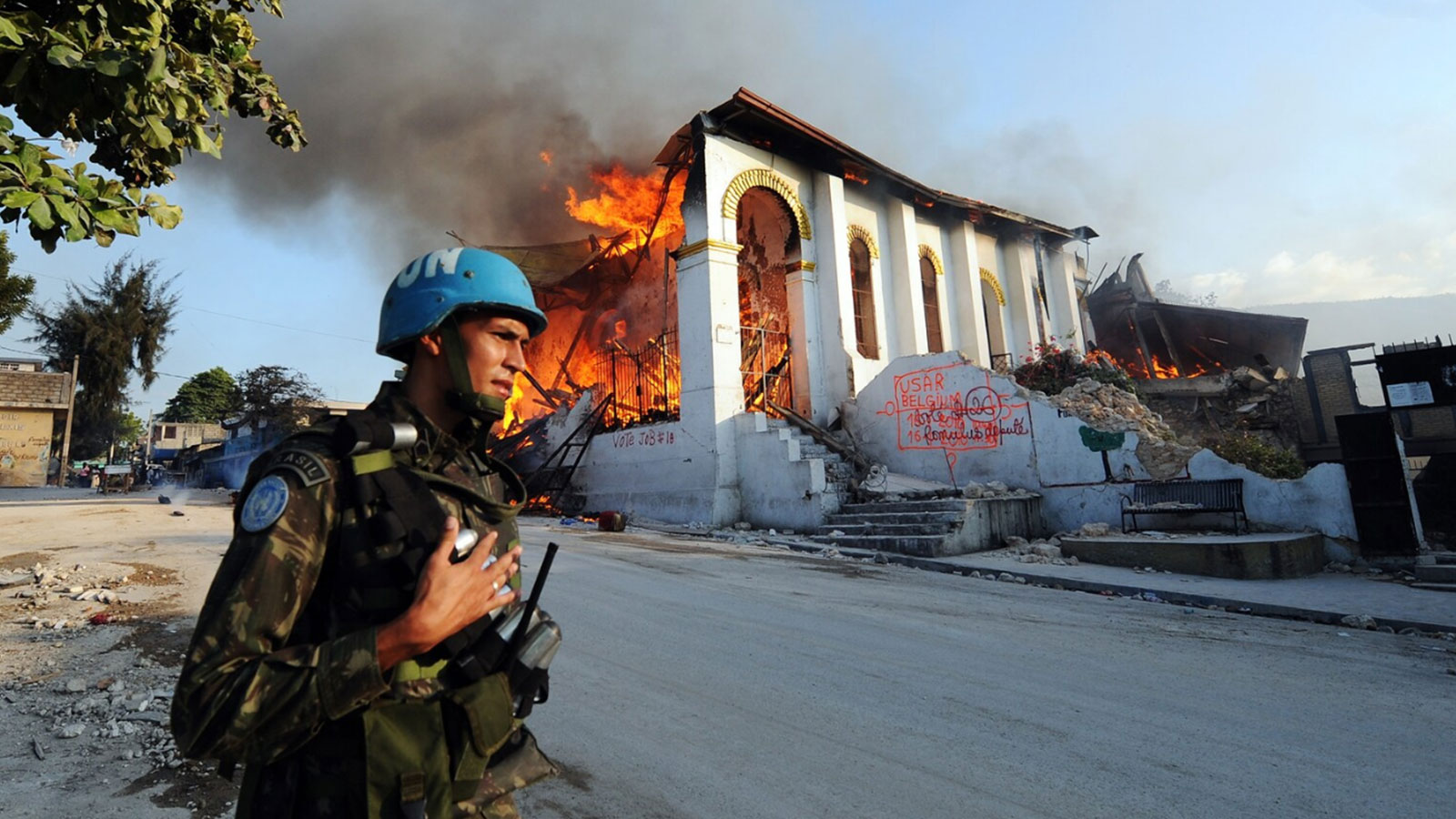 A U.N. soldier from Brazil secures an area near a burning church that collapsed during the Port-au-Prince earthquake on Jan. 18, 2010. 