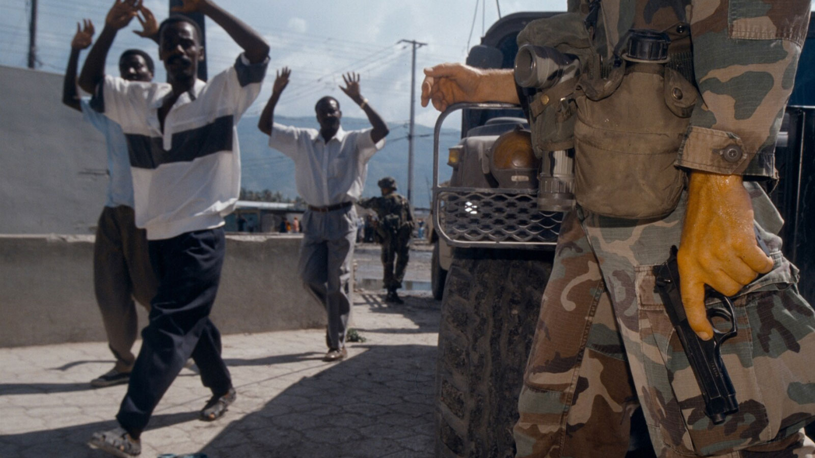 U.S. troops try to keep order after a deadly grenade attack by right-wing forces on a democracy march to support ousted president Jean-Bertrand Aristide on Sept. 29, 1994, in Port-au-Prince. 