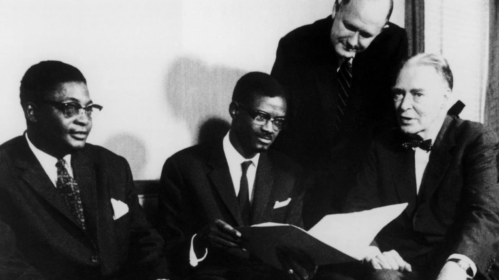 The Prime Minister of Congo Patrice Lumumba speaks with U.S. Secretary of State Christian Herter in Washington in July 1960.