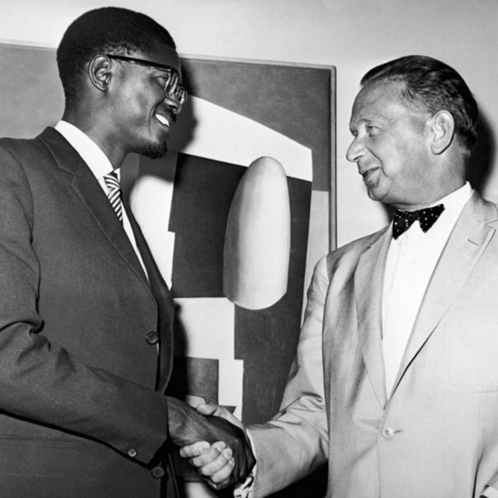 Congo Prime Minister Patrice Lumumba, left, shakes hands with United Nations Secretary-General Dag Hammarskjold, after their conference at the United Nations, N.Y., United States, on July 24, 1960. 