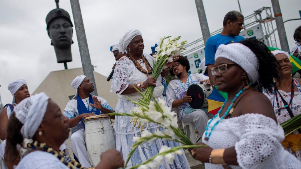 Women perform in front of a monument to Zumbi dos Palmares, an important leader in the resistance to slavery in Brazil, on Black Awareness Day in Rio de Janeiro.