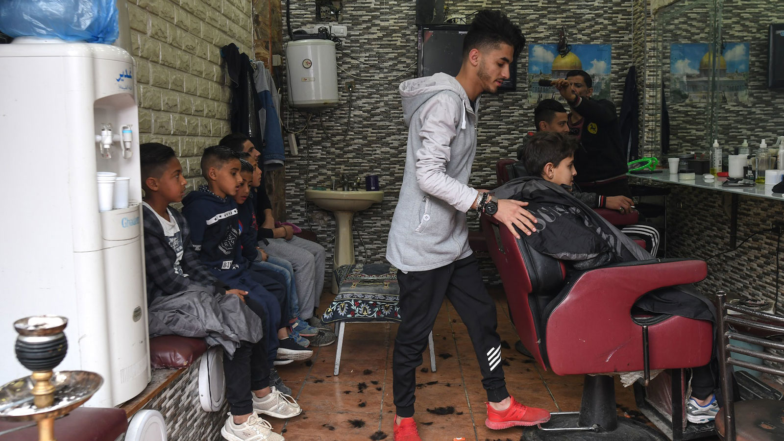 A local barbershop inside Al-Wehdat Palestinian refugee camp in Amman.