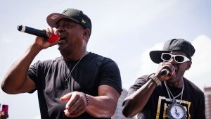 Chuck D and Flavor Flav of Public Enemy perform onstage during the Hip Hop 50th Birthday Jam By Universal Hip Hop Museum at Mill Pond Park on August 11, 2023 in New York City.