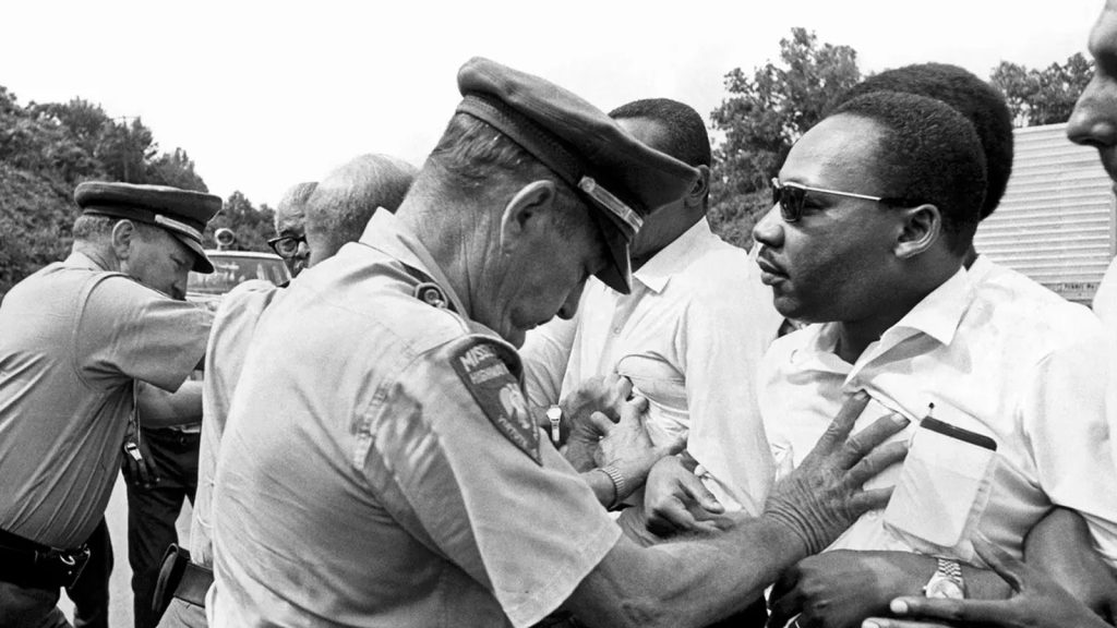 Dr. Martin Luther King being shoved back by Mississippi patrolmen during the 220 mile 'March Against Fear' from Memphis, Tennessee to Jackson, Mississippi, Mississippi, June 8, 1966.