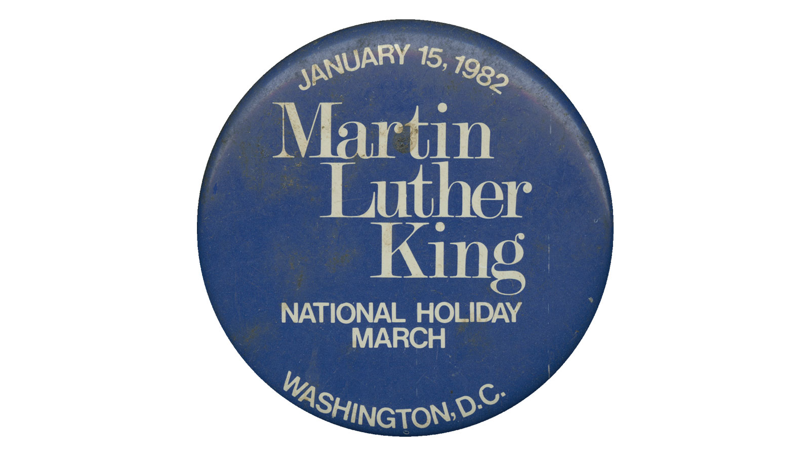 Pinback button promoting Martin Luther King Day 1982 (Collection of the Smithsonian National Museum of African American History and Culture)
