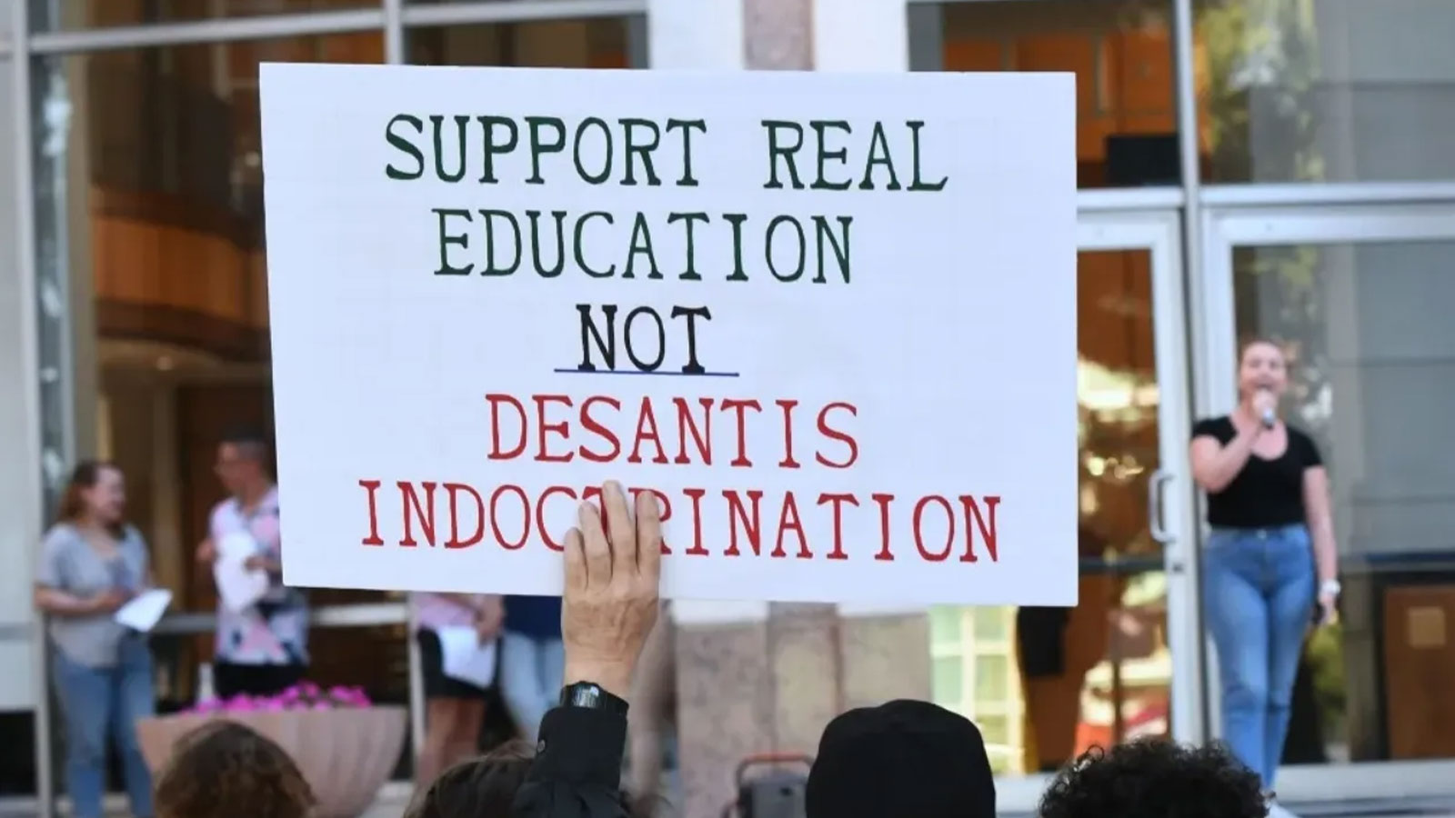 A protest sign is shown at a “Walkout 2 Learn” rally in April outside City Hall in Orlando, Florida. Students and others were reacting to Florida’s education policies. 