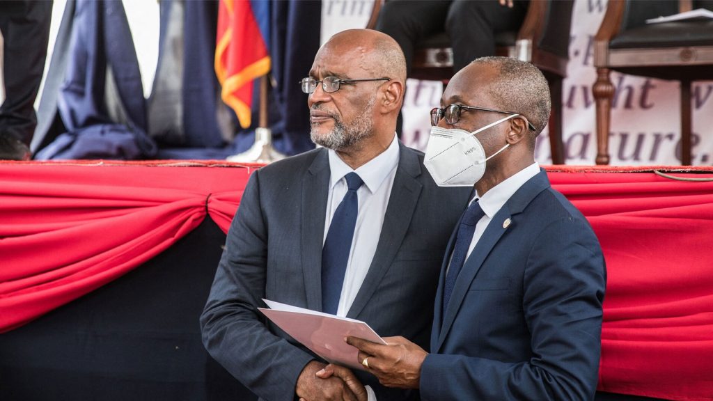 Haitian Prime Minister Ariel Henry, left, and Finance Minister Michel Patrick Boisvert during a ceremony in Port-au-Prince, Haiti, on July 20, 2021.