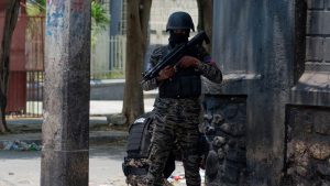 Haitian policemen stand guard on a street corner amid gang violence in Port-au-Prince on April 8,2024.