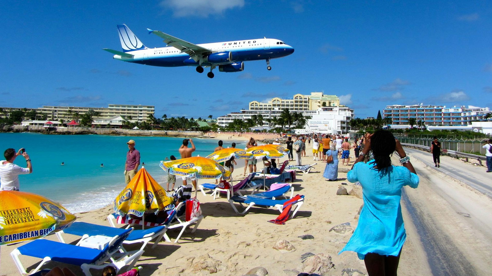 A plane lands in Sint Maarten. Visitors’ water needs come first on many islands that depend on tourism. 