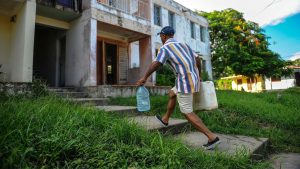 Man carries water in the Consolacion del Sur