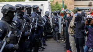 Police and pro-Palestinian students face off during a demonstration on the campus of Portland State University in Portland, Ore., on May 2, 2024.