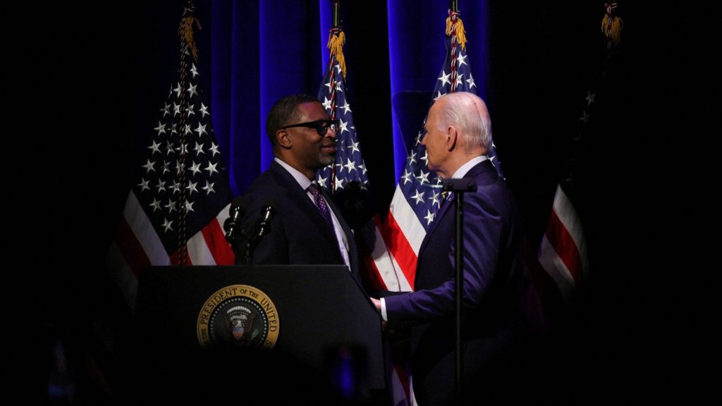 U.S. President Joe Biden speaks with President and CEO of NAACP Derrick Johnson at the National Museum of African American History and Culture in Washington, U.S. May 17, 2024.