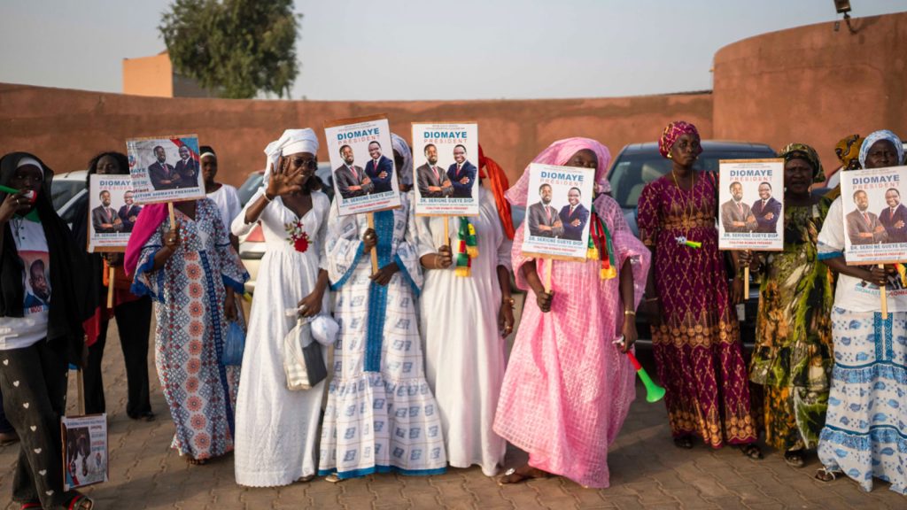 Supporters of Faye attend a final campaign rally in Mbour, Senegal, before the presidential election
