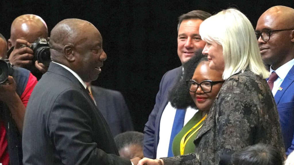 South African President Cyril Ramaphosa shakes hands with DA politician Annelie Lotriet; Reuters/Nic Bothma