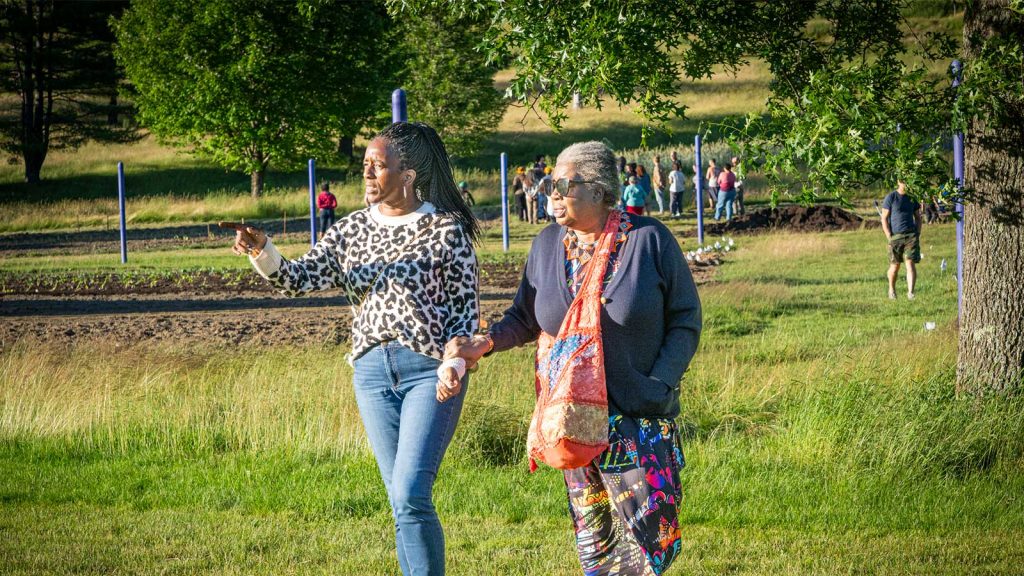 Attendees walking at the June 27 opening ceremony of the Paij Wadley-Bailey Community Garden, a BIPOC affinity space at Montpelier’s Country Club Road property.