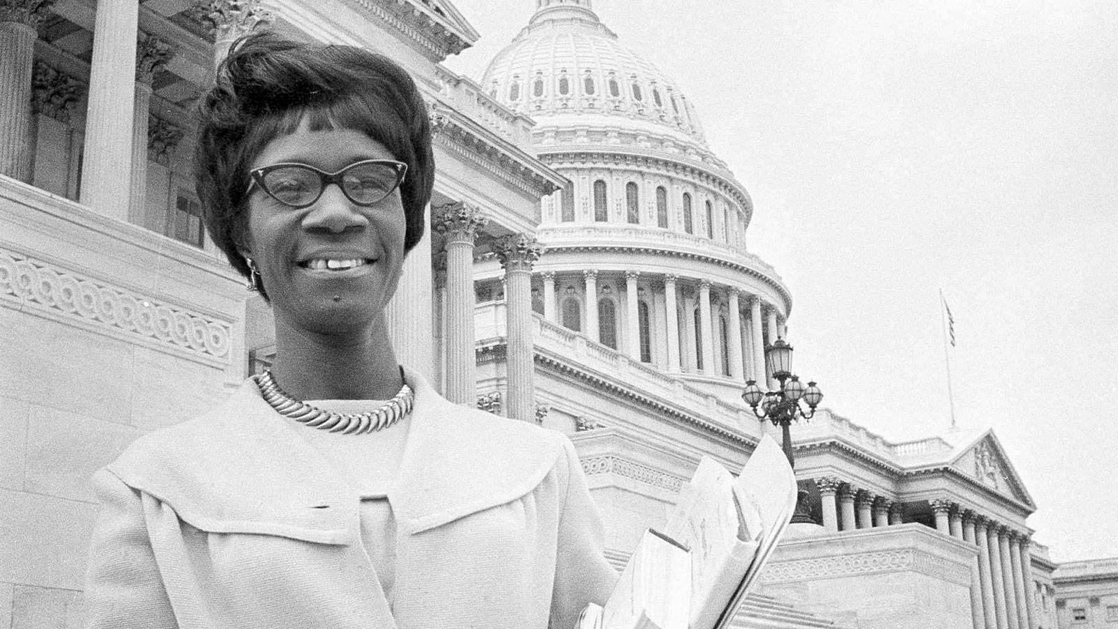 In this March 1969 photo, Rep. Shirley Chisholm, a New York Democrat, poses on the steps of the Capitol in Washington with material she plans to use in a speech before the House of Representatives.