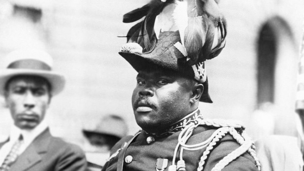 Photo of Marcus Mosiah Garvey in a military uniform as the "Provisional President of Africa" during a parade on the opening day of the annual Convention of the Negro Peoples of the World at Lenox Avenue in Harlem, New York City, in August 1922.