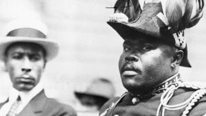 Photo of Marcus Mosiah Garvey in a military uniform as the "Provisional President of Africa" during a parade on the opening day of the annual Convention of the Negro Peoples of the World at Lenox Avenue in Harlem, New York City, in August 1922.