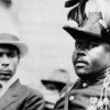 Photo of Marcus Mosiah Garvey in a military uniform as the "Provisional President of Africa" during a parade on the opening day of the annual Convention of the Negro Peoples of the World at Lenox Avenue in Harlem, New York City, in August 1922.