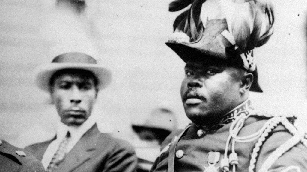 Photo of Marcus Mosiah Garvey in a military uniform as the "Provisional President of Africa" during a parade on the opening day of the annual Convention of the Negro Peoples of the World at Lenox Avenue in Harlem, New York City, in August 1922.