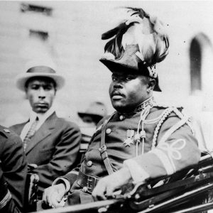 Photo of Marcus Mosiah Garvey in a military uniform as the "Provisional President of Africa" during a parade on the opening day of the annual Convention of the Negro Peoples of the World at Lenox Avenue in Harlem, New York City, in August 1922.