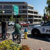 People watch as Springfield Police Department officers investigate the Springfield City Hall after bomb threats were made against buildings earlier in the day in Springfield, Ohio, on September 12, 2024.