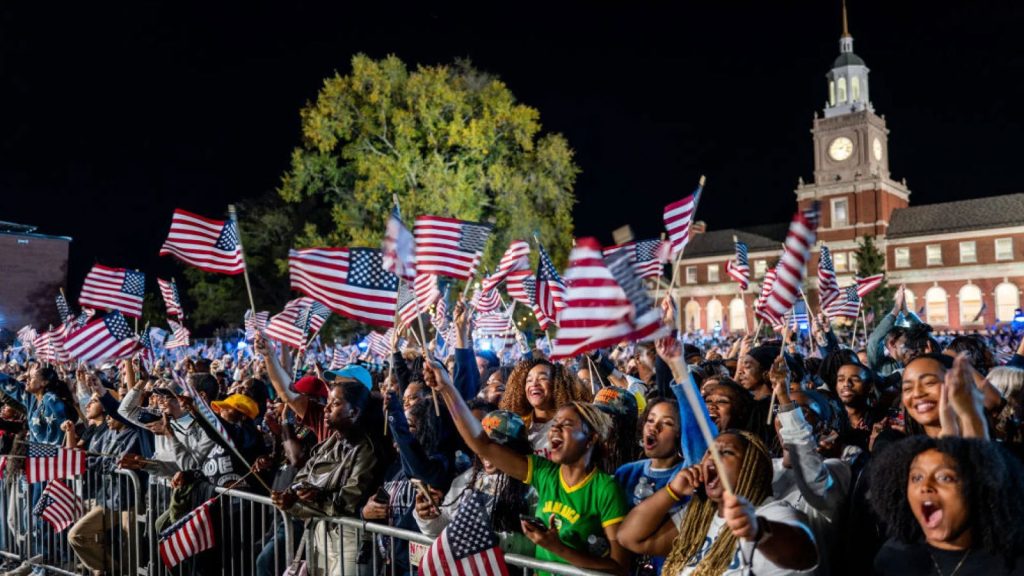 WASHINGTON, DC – NOVEMBER 05: Supporters wave flags during an election night event held by Democratic presidential nominee, U.S. Vice President Kamala Harris at Howard University on November 05, 2024 in Washington, DC. Americans cast their ballots today in the presidential race between Republican nominee former President Donald Trump and Vice President Kamala Harris, as well as multiple state elections that will determine the balance of power in Congress.