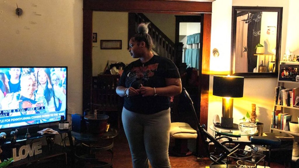 First-time voter Selena Greene watches election coverage at home. Greene cast her ballot for Kamala Harris.