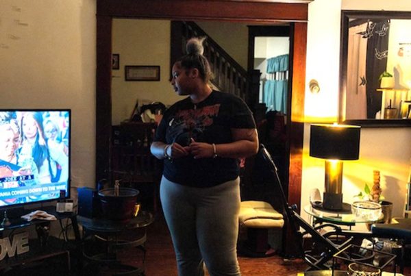 First-time voter Selena Greene watches election coverage at home. Greene cast her ballot for Kamala Harris.