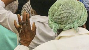 A woman holds a rosary as she prays during an eucharistic adoration event at Notre Dame d'Haiti, the Catholic church at the heart of the Haitian diaspora, March 29, 2025, in Miami.