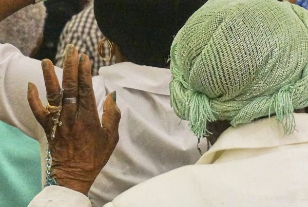A woman holds a rosary as she prays during an eucharistic adoration event at Notre Dame d'Haiti, the Catholic church at the heart of the Haitian diaspora, March 29, 2025, in Miami.