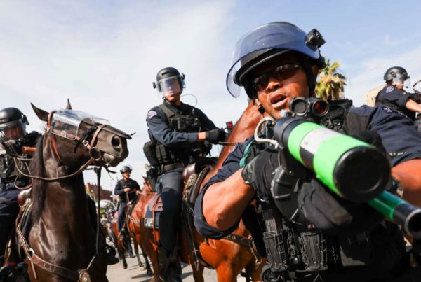 Protesters face off with police outside of a federal building in downtown Los Angeles for an anti-Trump "No Kings Day" demonstration in a city that has been the focus of protests against Trump's immigration raids on June 14, 2025, in Los Angeles, California.