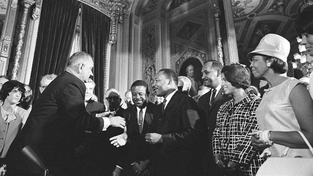 President Lyndon B. Johnson meets with Martin Luther King, Jr., at the signing of the Voting Rights Act of 1965