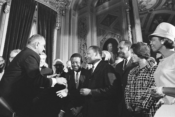 President Lyndon B. Johnson meets with Martin Luther King, Jr., at the signing of the Voting Rights Act of 1965