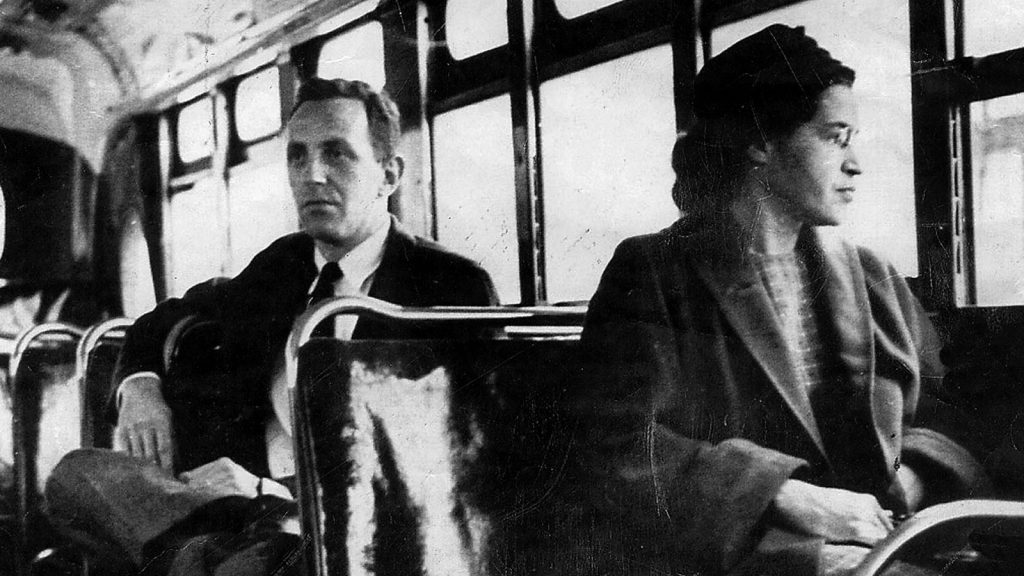Rosa Parks riding a Montgomery bus immediately following the decision to desegregate buses. (Wikipedia)