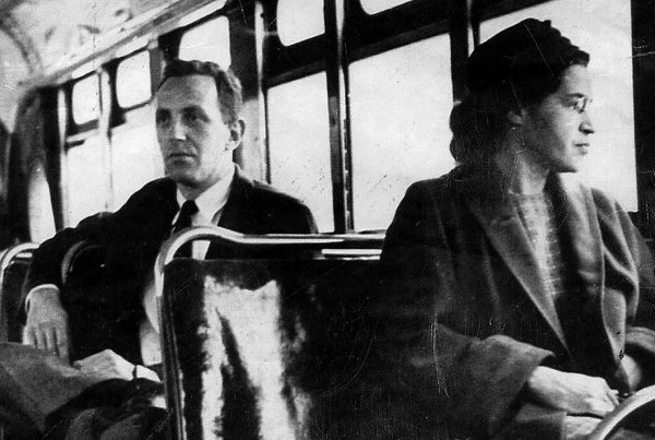 Rosa Parks riding a Montgomery bus immediately following the decision to desegregate buses. (Wikipedia)
